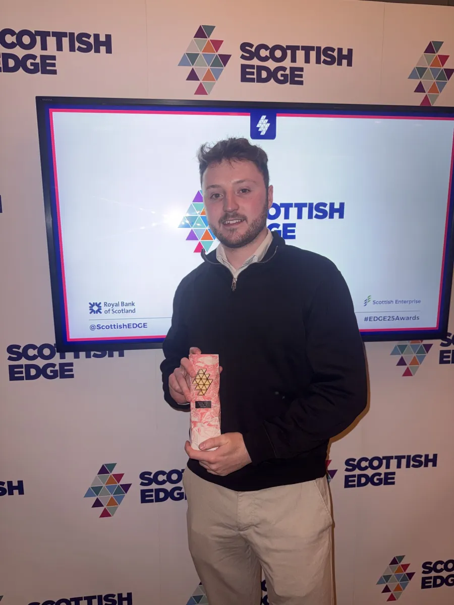 Callum Leith holding the Scottish EDGE award